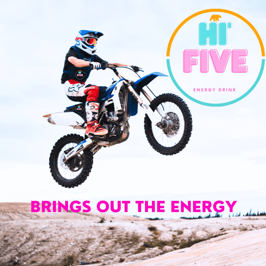 A man on a dirt bike jumping over some sand.